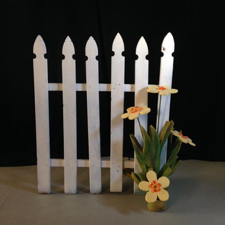 Scenic element - a white gate with flowers
