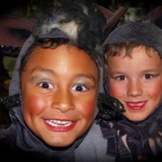 Two happy boys in rat costumes