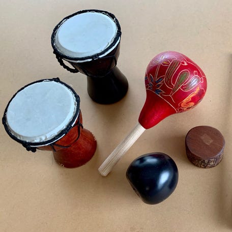 Several small percussion instruments made from natural materials.