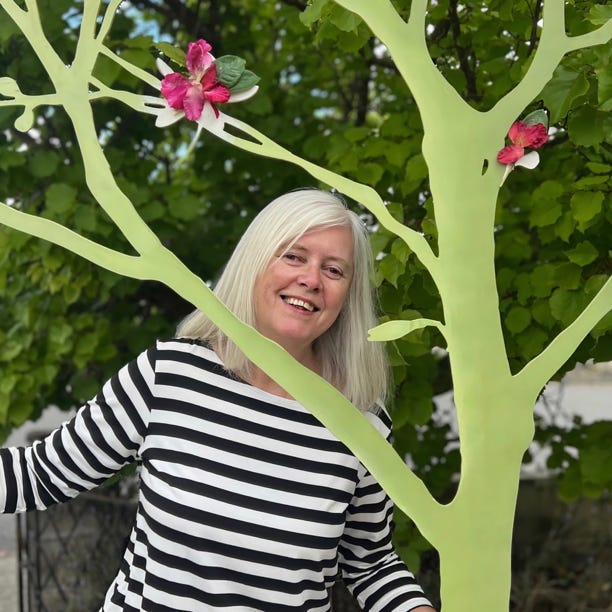 Calico director Jenny Wake with woodland scenery.
