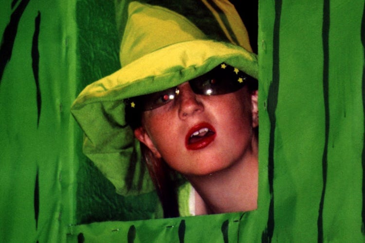 The Gatekeeper looking out a window in the gate to the Emerald City