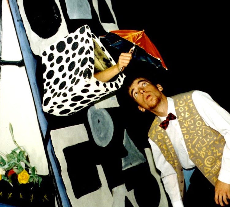The Mathemagician gives Tyro an umbrella through the chimney of her quirky little house.