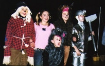 Dorothy with the scarecrow, lion, tin man and Toto