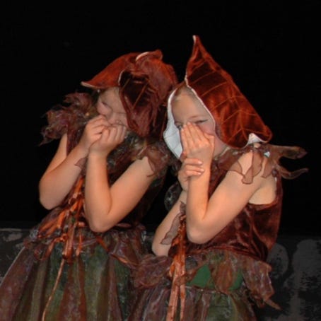 Two mischeivous sprites giggling