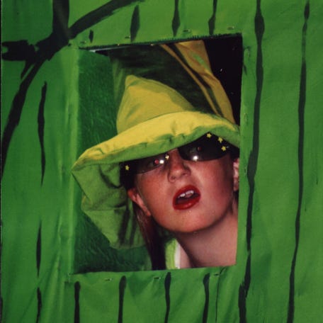 The Gatekeeper looking out a window in the gate to the Emerald City